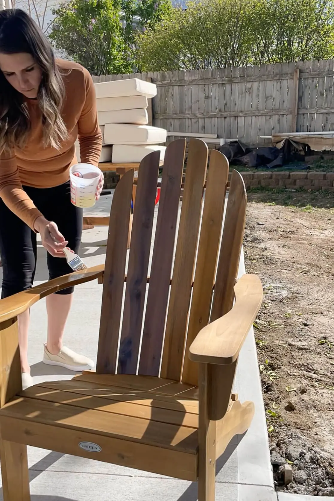 Using Thompson's WaterSeal to protect outdoor patio furniture.